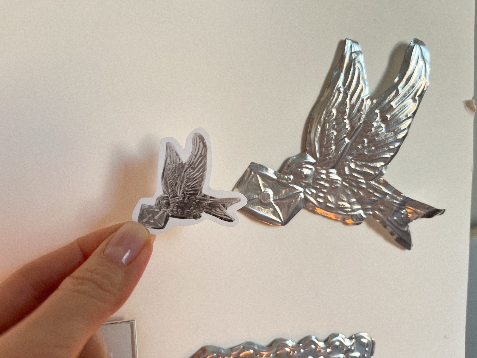 Bird sticker and sculpture detail