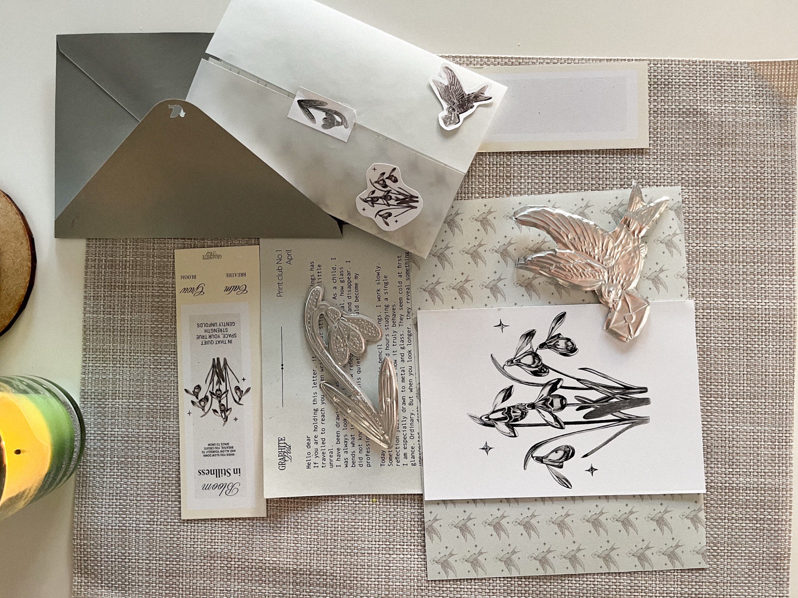 Art print and package contents on linen background